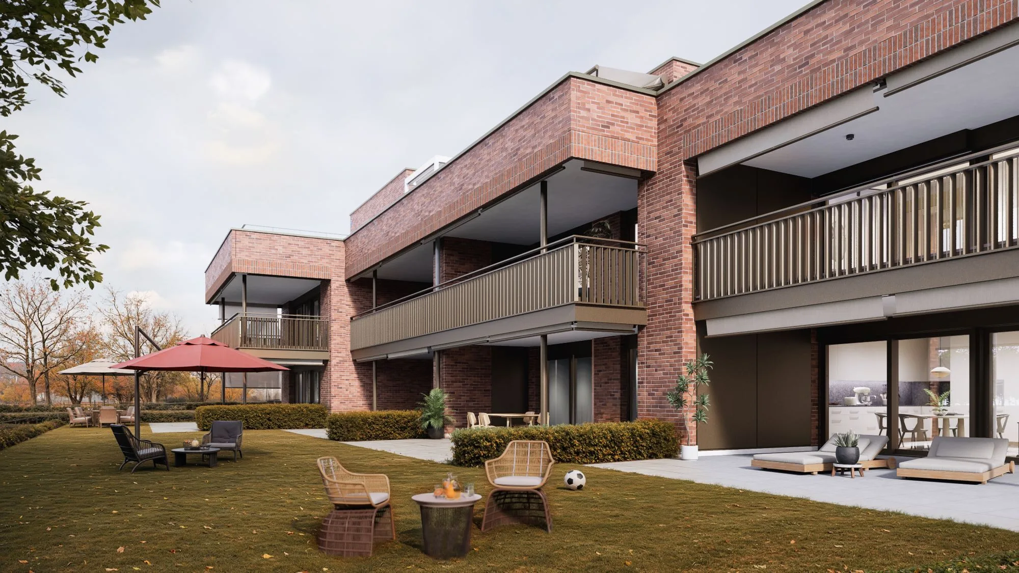 Moderne Wohnanlage mit Terrasse und Gartenmöbeln.